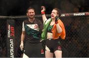 24 October 2015; Aisling Daly, with her coach John Kavanagh, following her victory over Ericka Almeida. UFC Fight Night. 3Arena, Dublin. Picture credit: Stephen McCarthy / SPORTSFILE