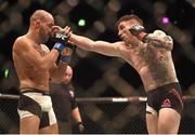 24 October 2015; Norman Parke, right, in action against Reza Madadi. UFC Fight Night. 3Arena, Dublin. Picture credit: Stephen McCarthy / SPORTSFILE