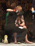 24 October 2015; Paddy Holohan is consoled after being defeated by Louis Smolka. UFC Fight Night, Patrick Holohan v Louis Smolka. 3Arena, Dublin. Picture credit: Stephen McCarthy / SPORTSFILE