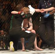 24 October 2015; Paddy Holohan is consoled after being defeated by Louis Smolka. UFC Fight Night, Patrick Holohan v Louis Smolka. 3Arena, Dublin. Picture credit: Stephen McCarthy / SPORTSFILE