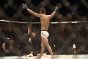 24 October 2015; Louis Smolka celebrates his victory over Paddy Holohan as a plastic glass is thrown into the octagon UFC Fight Night, Patrick Holohan v Louis Smolka. 3Arena, Dublin. Picture credit: Stephen McCarthy / SPORTSFILE