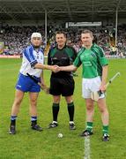 20 June 2009; The Waterford and Limerick captains Stephen Molumphy, left, and Mark Foley greet each other across referee Brian Gavin. GAA Hurling Munster Senior Championship Semi-Final Replay, Limerick v Waterford, Semple Stadium, Thurles, Co. Tipperary. Picture credit: Ray McManus / SPORTSFILE