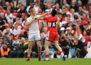 21 June 2009; Kevin Hughes, Tyrone, gets involved in a tussle with Eoin Bradley, Derry. GAA Football Ulster Senior Championship Semi-Final, Tyrone v Derry, Casement Park, Belfast, Co. Antrim. Photo by Sportsfile