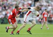 21 June 2009; Kevin Hughes, Tyrone, in action against Paul Murphy, Derry. GAA Football Ulster Senior Championship Semi-Final, Tyrone v Derry, Casement Park, Belfast, Co. Antrim. Picture credit: Oliver McVeigh / SPORTSFILE