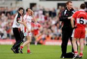 21 June 2009; Brian Dooher, Tyrone, looks over to Barry McGuigan, Derry, as he is taken off as a blood substitute, having previously been involved in an incident with him. GAA Football Ulster Senior Championship Semi-Final, Tyrone v Derry, Casement Park, Belfast, Co. Antrim. Photo by Sportsfile