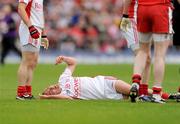 21 June 2009; Brian Dooher, Tyrone, lies on the ground after being involved in an incident with Barry McGuigan, Derry. GAA Football Ulster Senior Championship Semi-Final, Tyrone v Derry, Casement Park, Belfast, Co. Antrim. Photo by Sportsfile