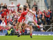 21 June 2009; Gerard O'Kane, Derry, in action against Martin Penrose and Kevin Hughes, right, Tyrone. GAA Football Ulster Senior Championship Semi-Final, Tyrone v Derry, Casement Park, Belfast, Co. Antrim. Photo by Sportsfile