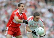 21 June 2009; Stephen O'Neill, Tyrone, in action against Sean Marty Lockhart, Derry. GAA Football Ulster Senior Championship Semi-Final, Tyrone v Derry, Casement Park, Belfast, Co. Antrim. Picture credit: Daire Brennan / SPORTSFILE