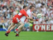 21 June 2009; Tommy McGuigan, Tyrone, in action against Barry McGuigan, Derry. GAA Football Ulster Senior Championship Semi-Final, Tyrone v Derry, Casement Park, Belfast, Co. Antrim. Picture credit: Daire Brennan / SPORTSFILE