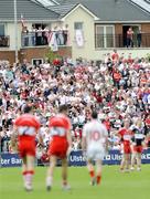 21 June 2009; Supporters watch the match from apartments outside the ground. GAA Football Ulster Senior Championship Semi-Final, Tyrone v Derry, Casement Park, Belfast, Co. Antrim. Picture credit: Oliver McVeigh / SPORTSFILE