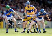 21 June 2009; Niall Gilligan, Clare, supported by team-mate David Barrett, in action against Declan Fanning, left, and Conor O'Brien, Tipperary. GAA Hurling Munster Senior Championship Semi-Final, Tipperary v Clare, Gaelic Grounds, Limerick. Picture credit: Brendan Moran / SPORTSFILE