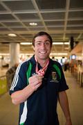 21 June 2009; Clondalkin's Olympic medallist Kenny Egan displays the bronze medal he won at the European Union Championships in Odense, Denmark, during the Irish team's arrival home at Dublin Airport, Dublin. Picture credit: John Barrington / SPORTSFILE