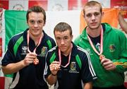 21 June 2009; Ireland's three goal medalists, Darren O'Neill, David Oliver Joyce and Con Sheehan, display the Gold Medals they won at the European Union Championships in Odense, Denmark, during the Irish team's arrival home at Dublin Airport, Dublin. Picture credit: John Barrington / SPORTSFILE