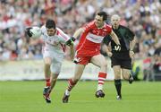 21 June 2009; Sean Cavanagh, Tyrone, in action against Kevin McGuckin, Derry. GAA Football Ulster Senior Championship Semi-Final, Tyrone v Derry, Casement Park, Belfast, Co. Antrim. Picture credit: Oliver McVeigh / SPORTSFILE