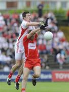 21 June 2009; Sean Cavanagh, Tyrone, in action against Gerard O'Kane, Derry. GAA Football Ulster Senior Championship Semi-Final, Tyrone v Derry, Casement Park, Belfast, Co. Antrim. Picture credit: Oliver McVeigh / SPORTSFILE