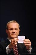 24 June 2009; Giorgio Marchetti, Director Competitions, pulls out the name of Glentoran Belfast United, Northern Ireland, who were drawn alongside Linköpings FC, Sweeden, CFF Clujana, Romania, and FC Roma Calfa, Moldova. UEFA Women's Champions League Qualifying Round Draw, UEFA Headquarters, Nyon, Switzerland. Picture credit: Stephen McCarthy / SPORTSFILE