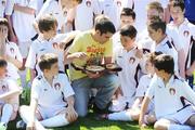 24 June 2009; WBA World Super Bantamweight Champion Bernard Dunne shows off his belt to participants during a visit to the St Patrick's Athletic Summer Soccer Camp being held this week. Richmond Park, Dublin. Picture credit: Brendan Moran / SPORTSFILE