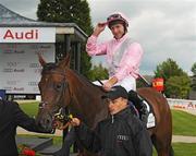 27 June 2009; Jimmy Fortune celebrates onboard his mount, Dar Re Mi, after winning the Audi Pretty Polly Stakes. Curragh Racecourse, Co. Kildare. Picture credit: Pat Murphy / SPORTSFILE