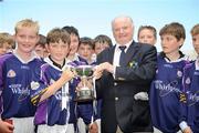 23 June 2009; Scoil Lorcan, Kilmacud, captain Tom Fox, age 11, is presented with the Corn Oideachais by Tadhg Kenny, President of Cumann na mBunscoil. Allianz Cumann na mBunscoil Finals, Scoil Mhuire v Scoil Lorcan, Croke Park, Dublin. Picture credit: Brian Lawless / SPORTSFILE