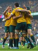 25 October 2015; Rob Simmons, Australia, is congratulated by team-mates after scoring his side's first try of the game. 2015 Rugby World Cup, Semi-Final, Argentina v Australia. Twickenham Stadium, Twickenham, London, England. Picture credit: Ramsey Cardy / SPORTSFILE