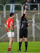 25 October 2015; David Kinsella, Palatine, is shown a black card by referee Anthony Nolan. AIB Leinster GAA Senior Club Football Championship, Palatine v Portlaoise OR Emo. Netwatch Dr. Cullen Park, Carlow. Photo by Sportsfile
