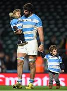 25 October 2015; Argentina's Juan Martin Fernandez Lobbe with his children following his side's loss. 2015 Rugby World Cup, Semi-Final, Argentina v Australia. Twickenham Stadium, Twickenham, London, England. Picture credit: Ramsey Cardy / SPORTSFILE
