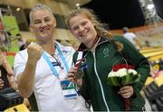 26 October 2015; Ireland's Noelle Lenihan, from Charleville, Co. Cork, celebrates with team official,  after winning silver in the Women's Discus F37. IPC Athletics World Championships. Doha, Qatar. Picture credit: Marcus Hartmann / SPORTSFILE