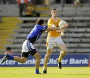 27 June 2009; Sean Burke, Antrim, in action against Dermot Sheridan, Cavan. GAA Football Ulster Senior Championship Semi-Final, Antrim v Cavan, St. Tighearnach's Park, Clones, Co. Monaghan. Picture credit: Oliver McVeigh / SPORTSFILE