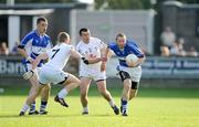 27 June 2009; Billy Sheehan, Laois, in action against Morgan O'Flaherty, 7, and Padraig O'Neill, Kildare. GAA Football Leinster Senior Championship Semi-Final, Kildare v Laois, O'Connor Park, Tullamore, Co. Offaly. Picture credit: Brendan Moran / SPORTSFILE