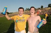 27 June 2009; Tony Scullion and Tomas McCann, Antrim, celebrate after the game. GAA Football Ulster Senior Championship Semi-Final, Antrim v Cavan, St. Tighearnach's Park, Clones, Co. Monaghan. Picture credit: Oliver McVeigh / SPORTSFILE