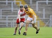 28 June 2009; Matthew Donnelly, Anrtrim, in action against  Gavin O'Neill, Derry. ESB Ulster Minor Hurling Championship Final, Anrtrim v Derry, Casement Park, Belfast, Co. Antrim. Picture credit: Oliver McVeigh / SPORTSFILE