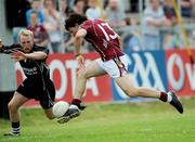 28 June 2009; Galway's Seán Armstrong shoots to score his side's only goal, despite the attention of Sligo's Paul McGovern, in the final moments of the game. GAA Football Connacht Senior Championship Semi-Final, Sligo v Galway, Markievicz Park, Sligo. Picture credit: Brian Lawless / SPORTSFILE