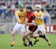 28 June 2009; Kieran Courtney, Down, in action against Joey Scullion and Shane McNaughton, Anrtrim. GAA Hurling Ulster Senior Championship Final, Antrim v Down, Casement Park, Belfast, Co. Antrim. Picture credit: Oliver McVeigh / SPORTSFILE *** Local Caption ***
