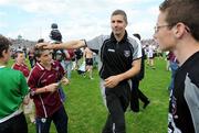 28 June 2009; Sligo manager Kevin Walsh taps the head of a young Galway supporter after the game. GAA Football Connacht Senior Championship Semi-Final, Sligo v Galway, Markievicz Park, Sligo. Picture credit: Ray Ryan / SPORTSFILE