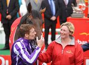 28 June 2009; Johnny Murtagh celebrates with Fame And Glory after winning the Dubai Duty Free Irish Derby as groom Routh Stapleton looks on. Irish Derby Festival - Sunday, Curragh Racecourse, Co. Kildare. Picture credit: Matt Browne / SPORTSFILE