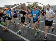 26 October 2015; Runners cross the James Joyce Bridge during the SSE Airtricity Dublin Marathon 2015. Dublin. Picture credit: Cody Glenn / SPORTSFILE