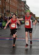 26 October 2015; Jeanette Keanan and Martin Larkin, Northern Ireland, near the finish during the SSE Airtricity Dublin Marathon 2015, Merrion Square, Dublin.Picture credit: Ray McManus / SPORTSFILE