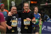 26 October 2015; Niall Clancy and Paddy Kealy, from Kilkenny, on their way to finishing the SSE Airtricity Dublin Marathon 2015, Merrion Square, Dublin. Picture credit: Tomas Greally / SPORTSFILE