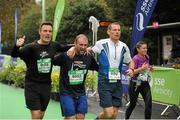 26 October 2015; John Paul Denker, Mark Condren and Dwain Moore, from Dublin, on their way to finishing the SSE Airtricity Dublin Marathon 2015, Merrion Square, Dublin. Picture credit: Tomas Greally / SPORTSFILE