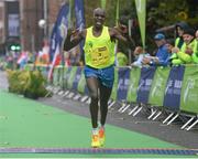 26 October 2015; Daniel Tanui, Kenya, crosses the finish line at the SSE Airtricity Dublin Marathon 2015, Merrion Square, Dublin. Picture credit: Seb Daly / SPORTSFILE