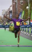 26 October 2015; Alemu Gemechu, Ethiopia, celebrates as he crosses the finish line to win the SSE Airtricity Dublin Marathon 2015, Merrion Square, Dublin. Picture credit: Seb Daly / SPORTSFILE