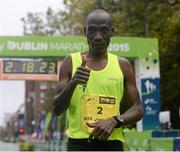 26 October 2015; Gideon Kimosop, Kenya, crosses the finish line at the SSE Airtricity Dublin Marathon 2015, Merrion Square, Dublin. Picture credit: Seb Daly / SPORTSFILE