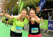 26 October 2015; Niamh Lohan and Fionnuala O' Connor, from Dublin, on their way to finishing the SSE Airtricity Dublin Marathon 2015, Merrion Square, Dublin. Picture credit: Tomas Greally / SPORTSFILE