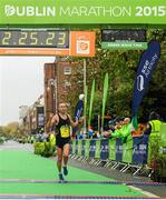26 October 2015; Gary O'Hanlon, Clonliffe Harriers AC, from Dublin, crosses the line to finish second in the National Marathon and eleventh overall during the SSE Airtricity Dublin Marathon 2015. Merrion Square, Dublin.  Picture credit: Tomas Greally / SPORTSFILE