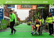 26 October 2015; Gary O'Hanlon, Clonliffe Harriers AC, from Dublin, is assisted by paramedics, after  finishing second in the National Marathon and eleventh overall during the SSE Airtricity Dublin Marathon 2015. Merrion Square, Dublin.  Picture credit: Tomas Greally / SPORTSFILE