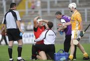 28 June 2009; Gareth Johnston, Down, receives treatment from the team physio. GAA Hurling Ulster Senior Championship Final, Antrim v Down, Casement Park, Belfast, Co. Antrim. Picture credit: Oliver McVeigh / SPORTSFILE