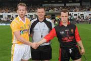 28 June 2009; Referee Brian Gavin with Antrim captain Neil McGarry, left, and Down captain Graham Clarke before the start of the game. GAA Hurling Ulster Senior Championship Final, Antrim v Down, Casement Park, Belfast, Co. Antrim. Picture credit: Oliver McVeigh / SPORTSFILE