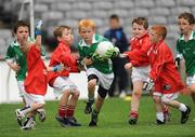 1 July 2009; Ross Bolger, Killeshan, Co. Laois, runs through the St. Nicholas, Co. Louth, defence during the Leinster GAA Go Games ‘Play & Stay with the GAA’ activity day. Croke Park, Dublin. Picture credit: Pat Murphy / SPORTSFILE