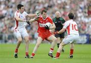 21 June 2009; Barry McGoldrick, Derry, in action against Sean Cavanagh and Martin Penrose, Tyrone. GAA Football Ulster Senior Championship Semi-Final, Tyrone v Derry, Casement Park, Belfast, Co. Antrim. Picture credit: Oliver McVeigh / SPORTSFILE