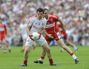 21 June 2009; Conor Gormley, Tyrone, in action against Paddy Bradley, Derry. GAA Football Ulster Senior Championship Semi-Final, Tyrone v Derry, Casement Park, Belfast, Co. Antrim. Picture credit: Oliver McVeigh / SPORTSFILE
